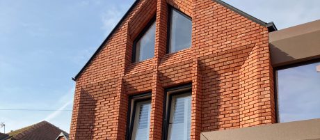 Beautiful red brick family home with large windows