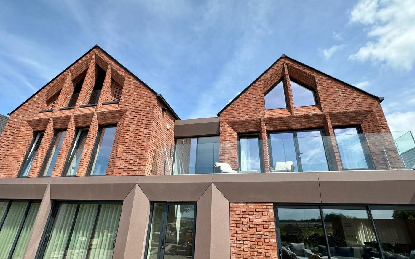 Big balcony on 2nd floor of the home with glass panels all around
