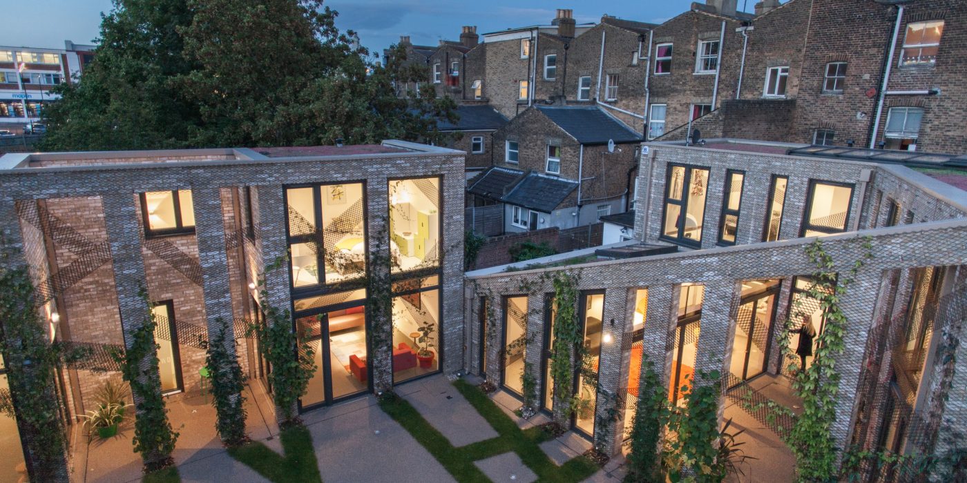 Modern residential development lit up at night