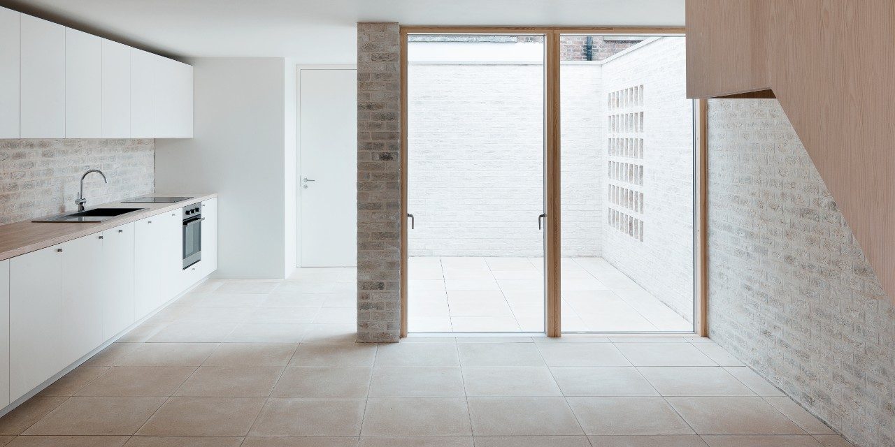 Contemporary house interior with white walls and large windows