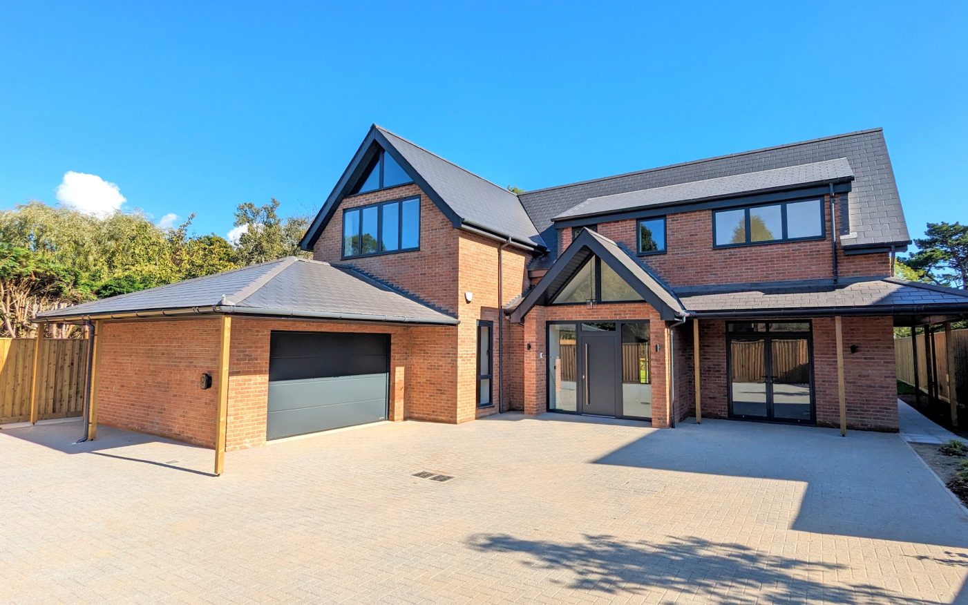 Large driveway leading up to two storey luxury home