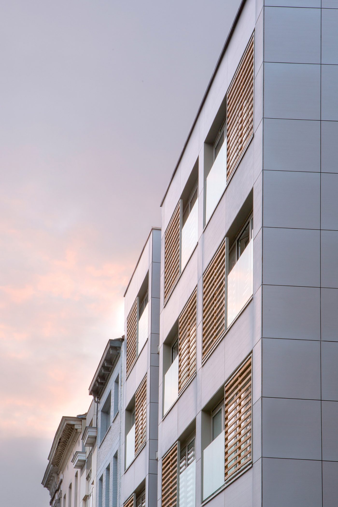 Modern apartment building against evening sky