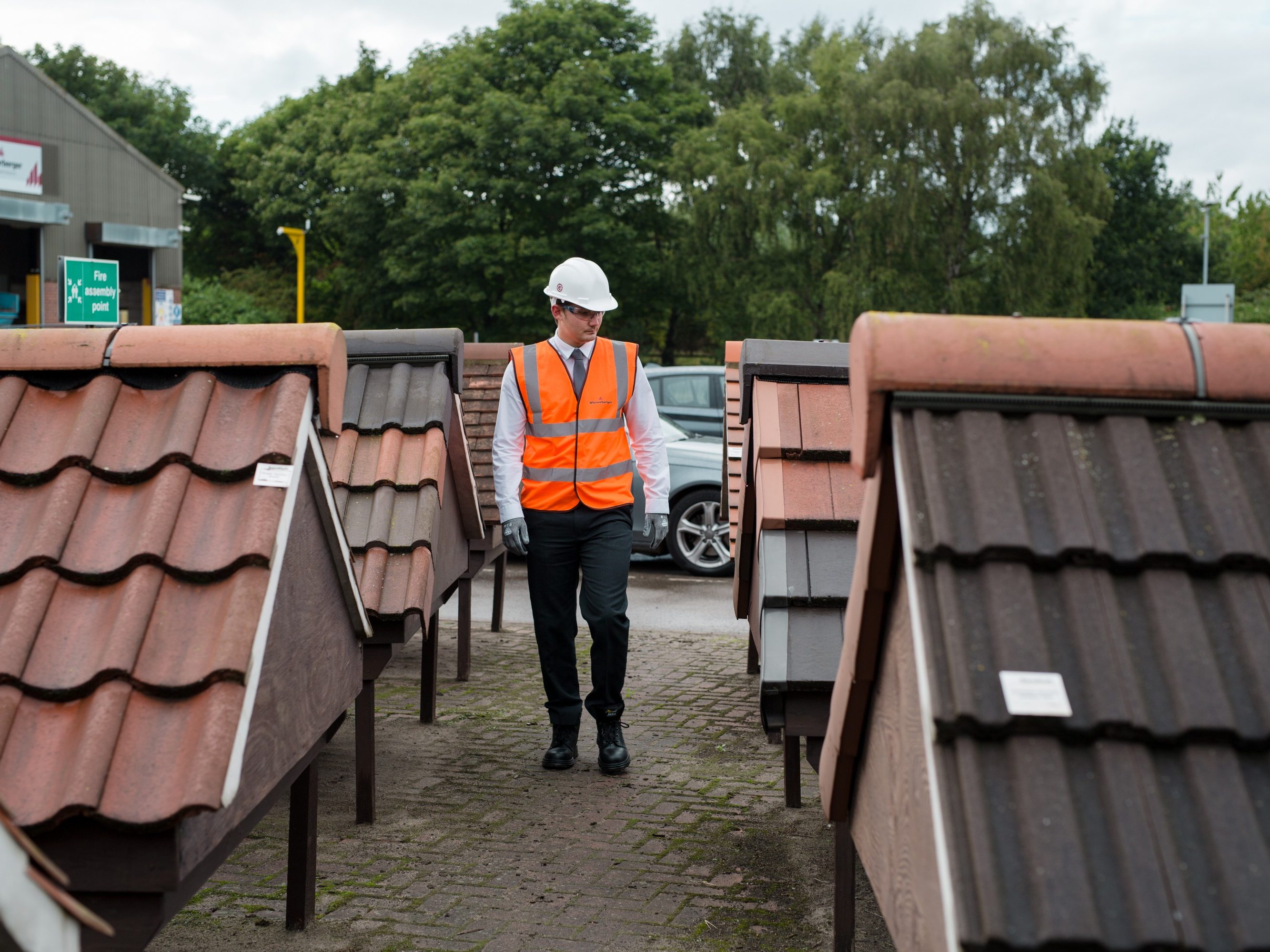 Man in high viz jacket walking round Sandtoft yard