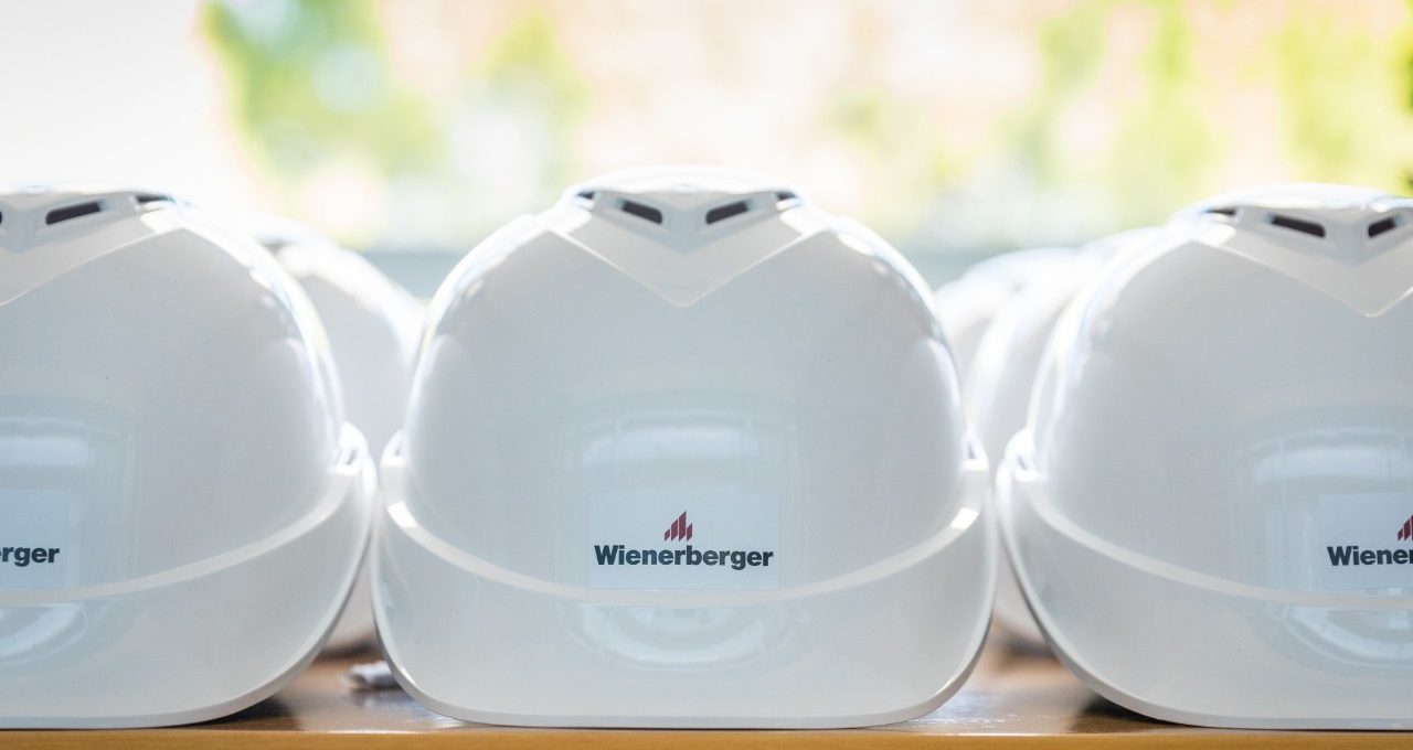 Row of Wienerberger branded protective headgear