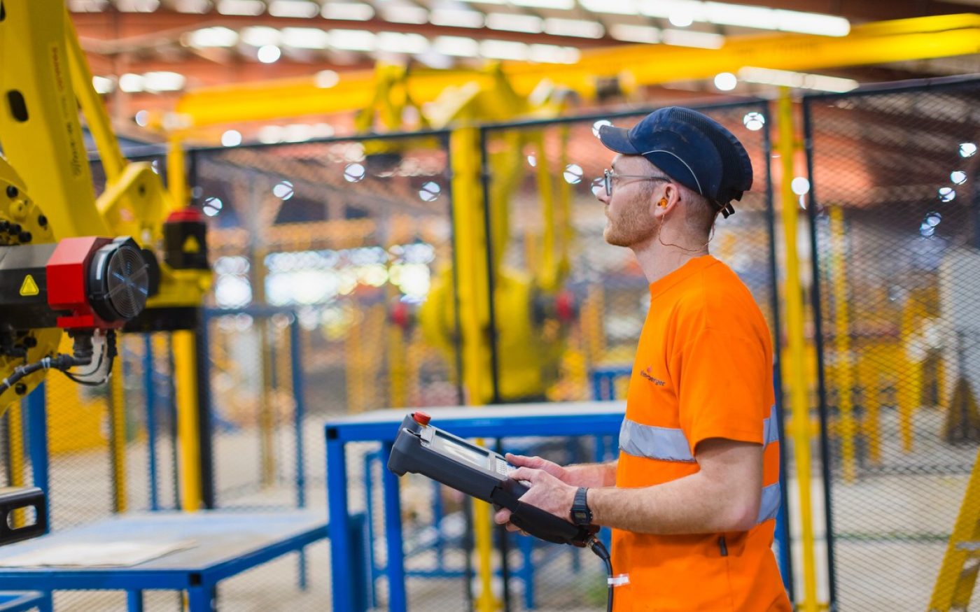 Engineer inspecting machinery at factory