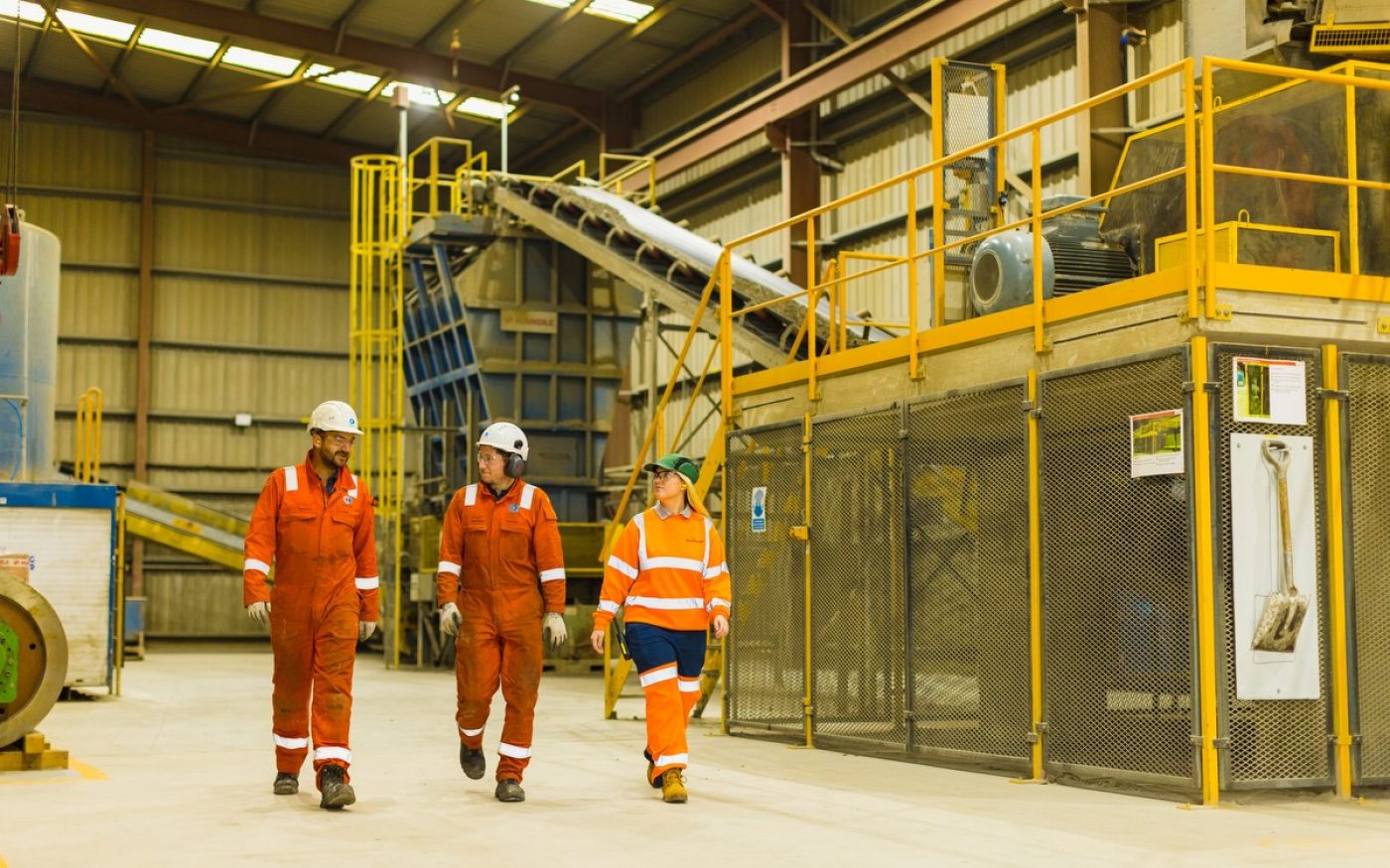 Three people walking through Wienerberger factory