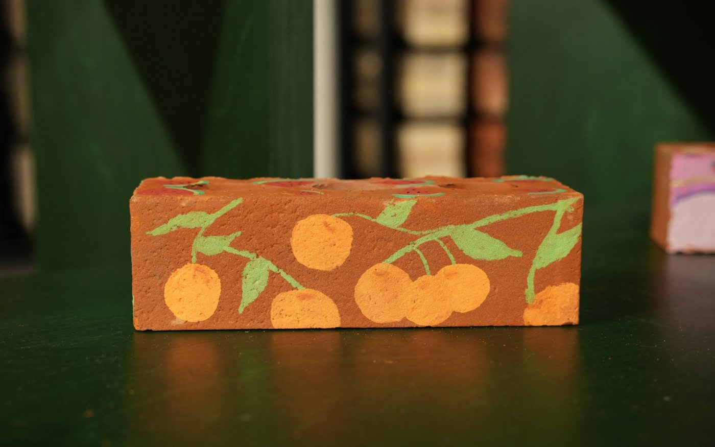 Brick with beautiful design of oranges drawn onto the side