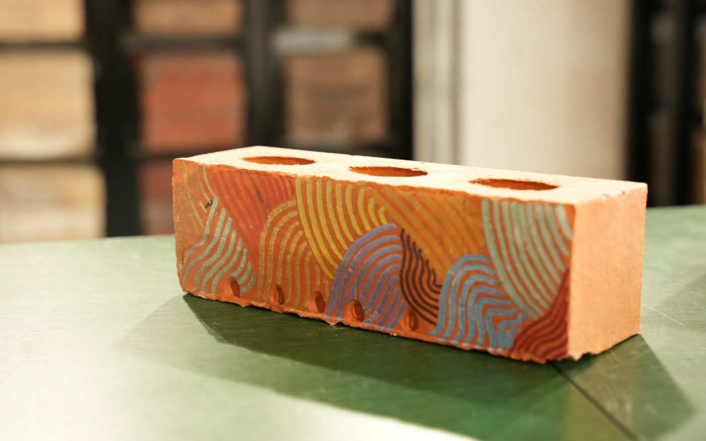 geometric colour shapes drawn onto a brick