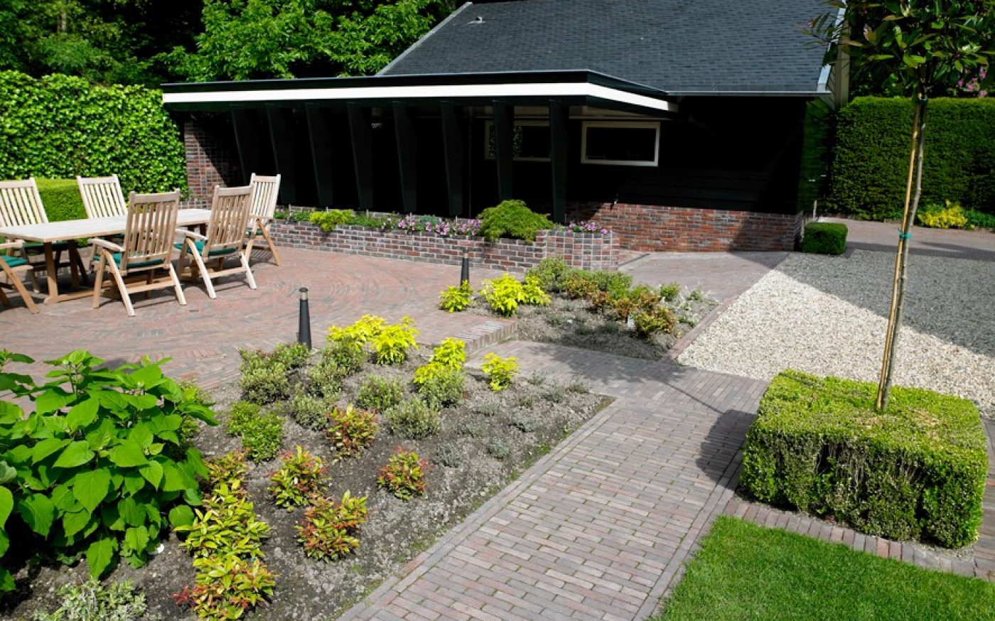 Newly planted garden with clay paved path