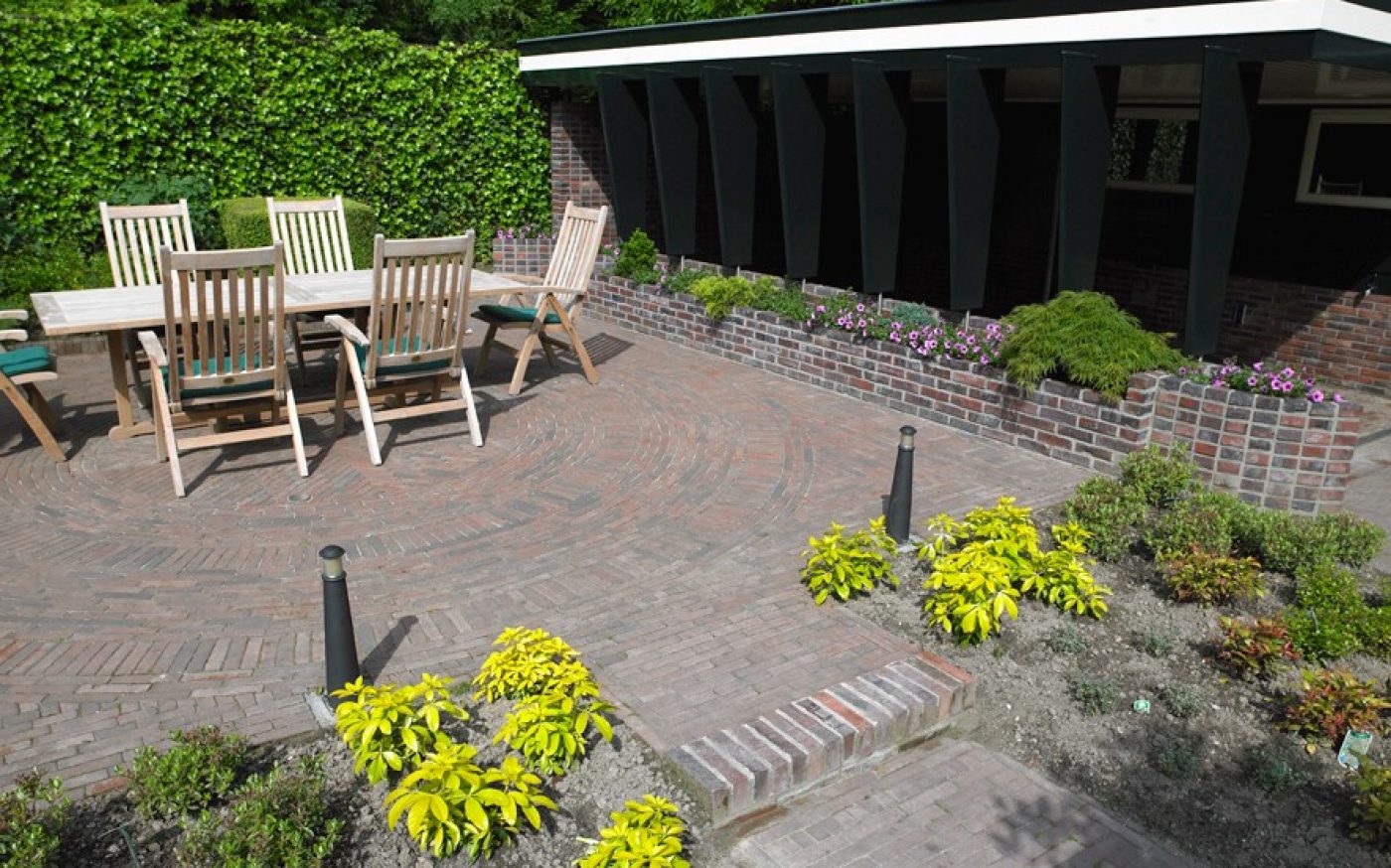 Modern clay paved patio area in garden