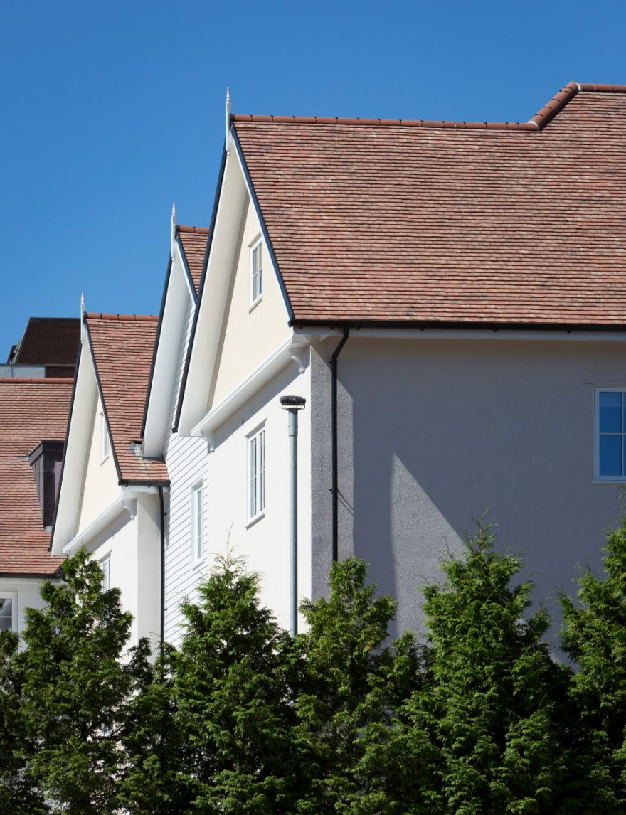 Roof gable ends of new houses with greenery