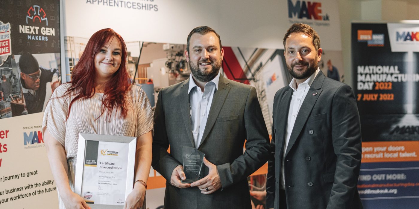 Karen Linton being presented with Gold Standard kitemark accreditation