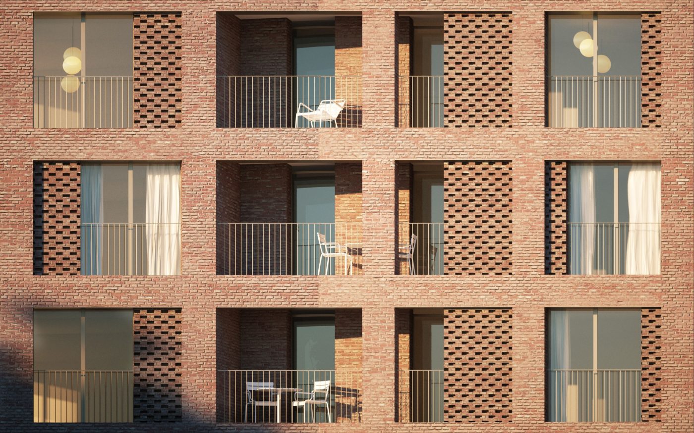Sun shining on balconies of modern red brick apartment building