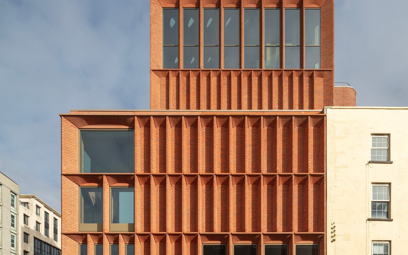 Vaulted brick building at Kiln Museum, leading to outdoor garden space