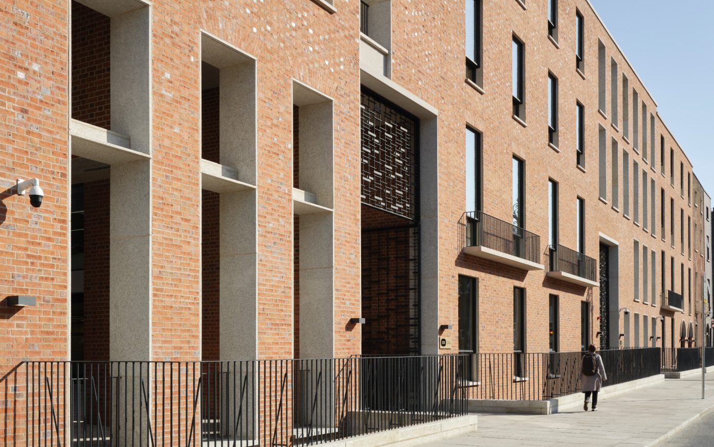 Pedestrian walking outside new ESB headquarters in Dublin