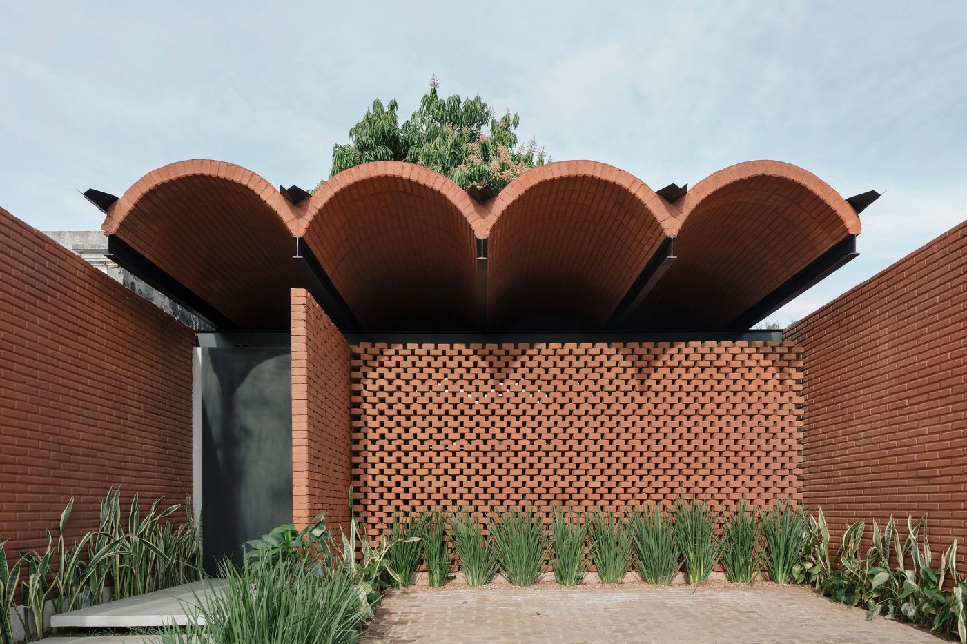 Intermediate House front with curved brick roof