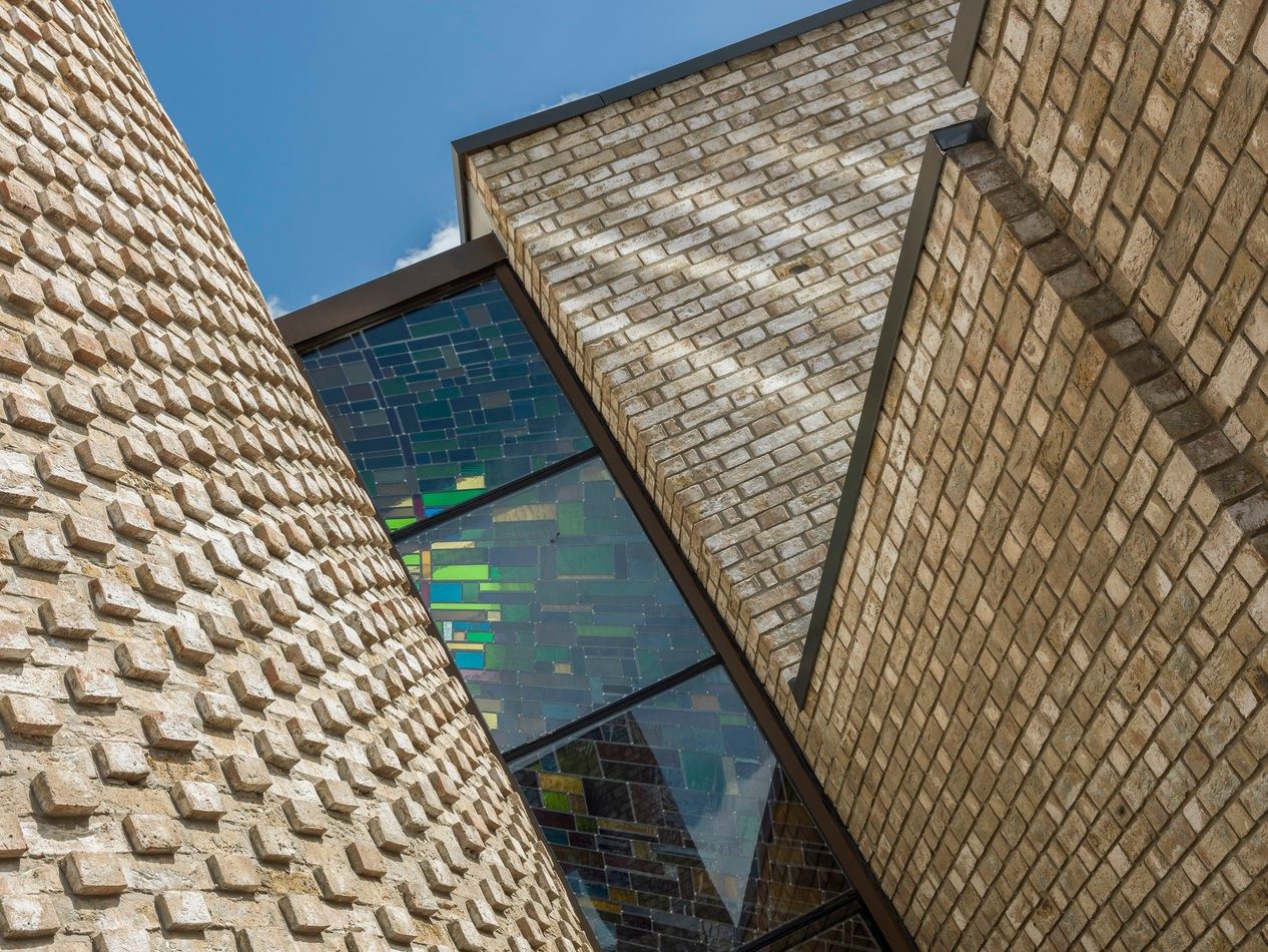 Modern brick building with stained glass window