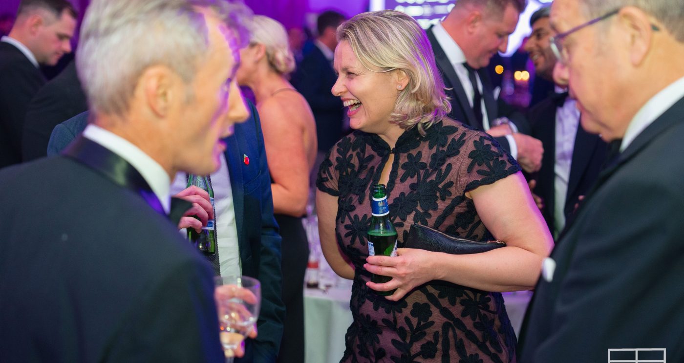 Women laughing with people at BDA Awards Evening