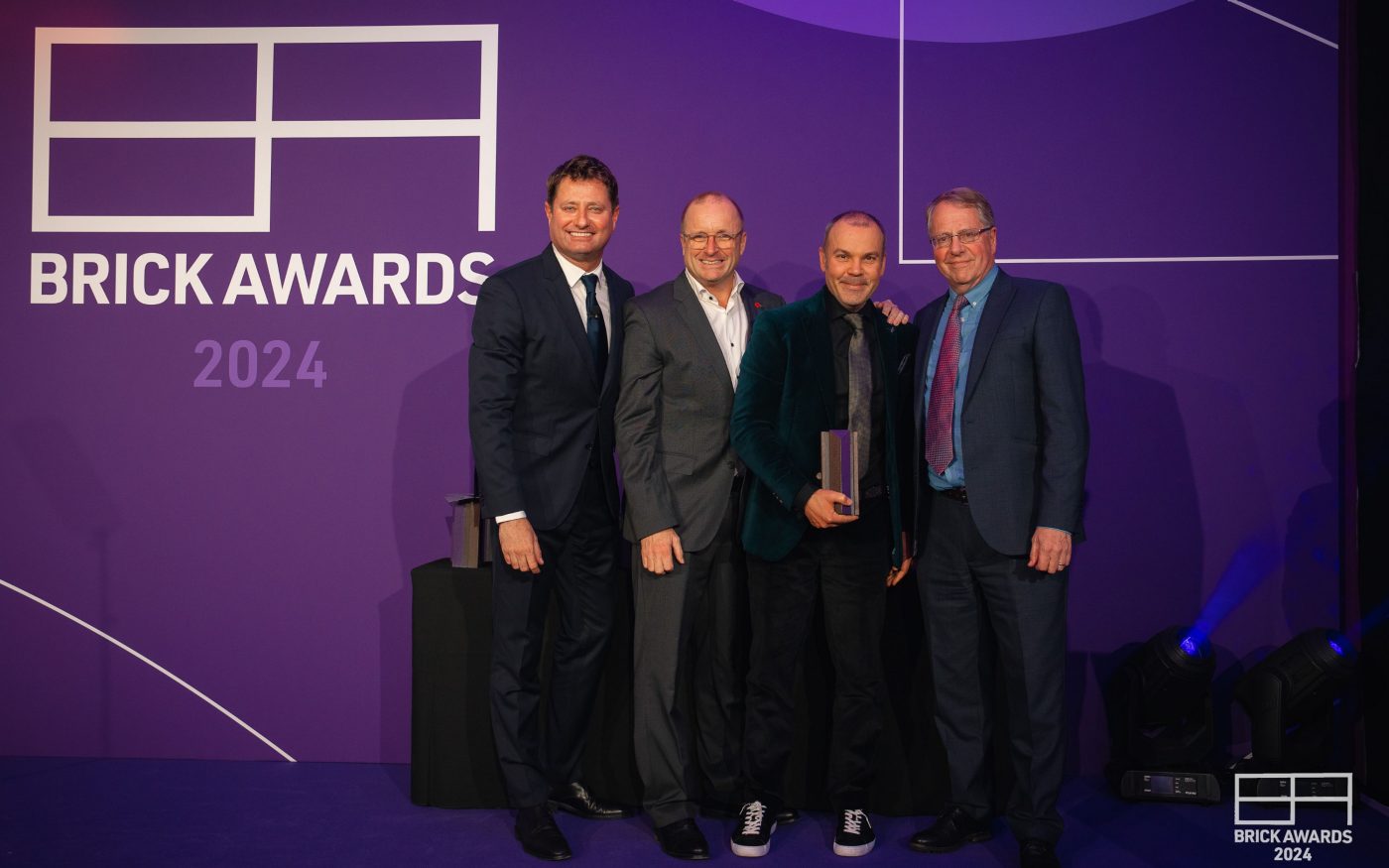 4 men stood against 'Brick Awards 2024" background