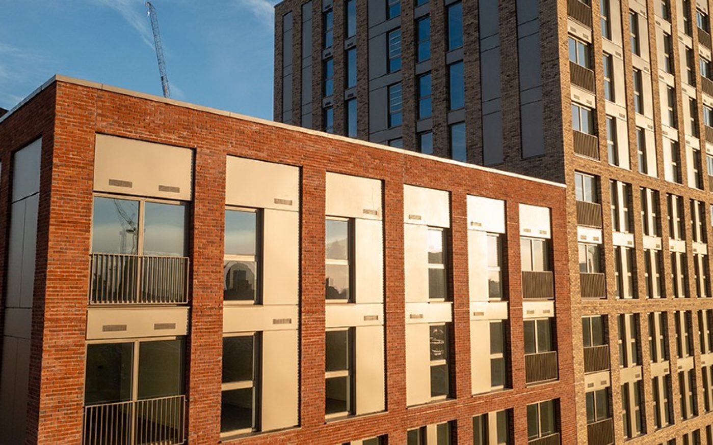 Sunset golden glow lighting up the large multi-storey development