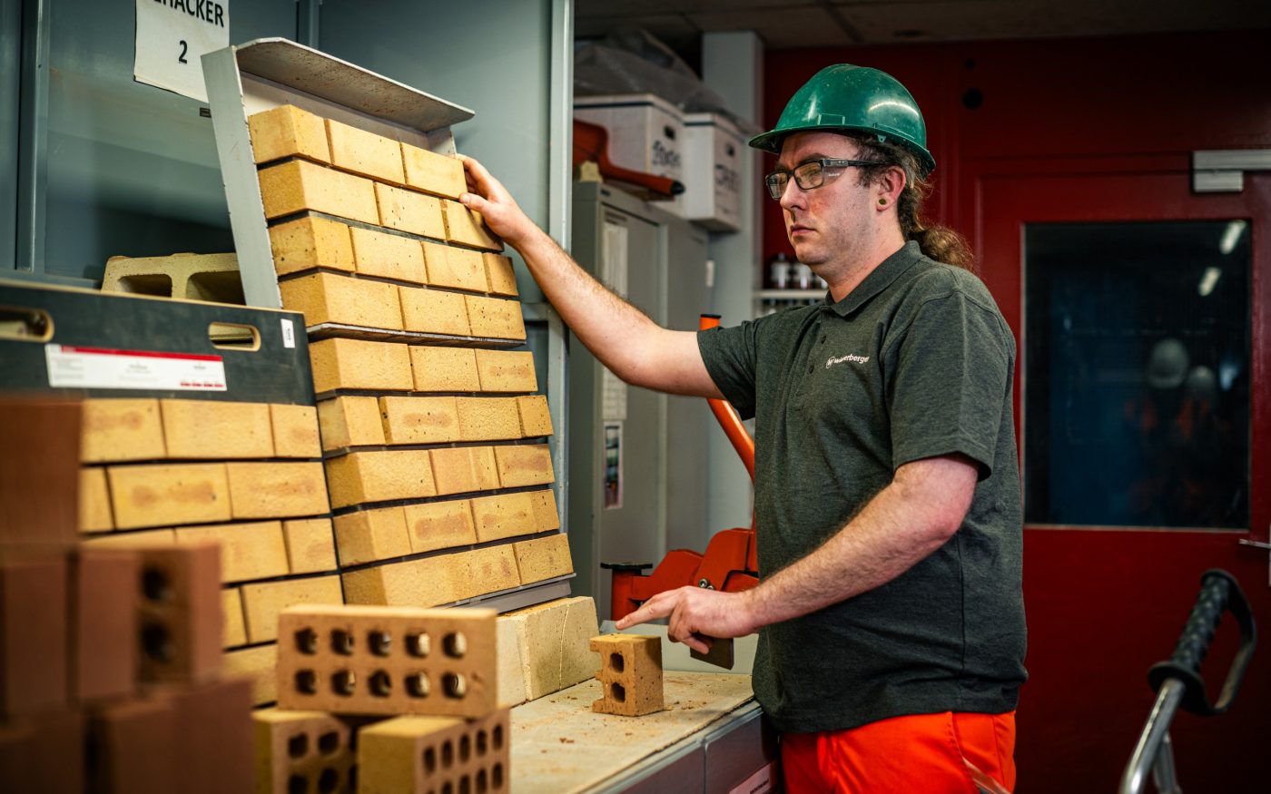 Image of a man organising bricks
