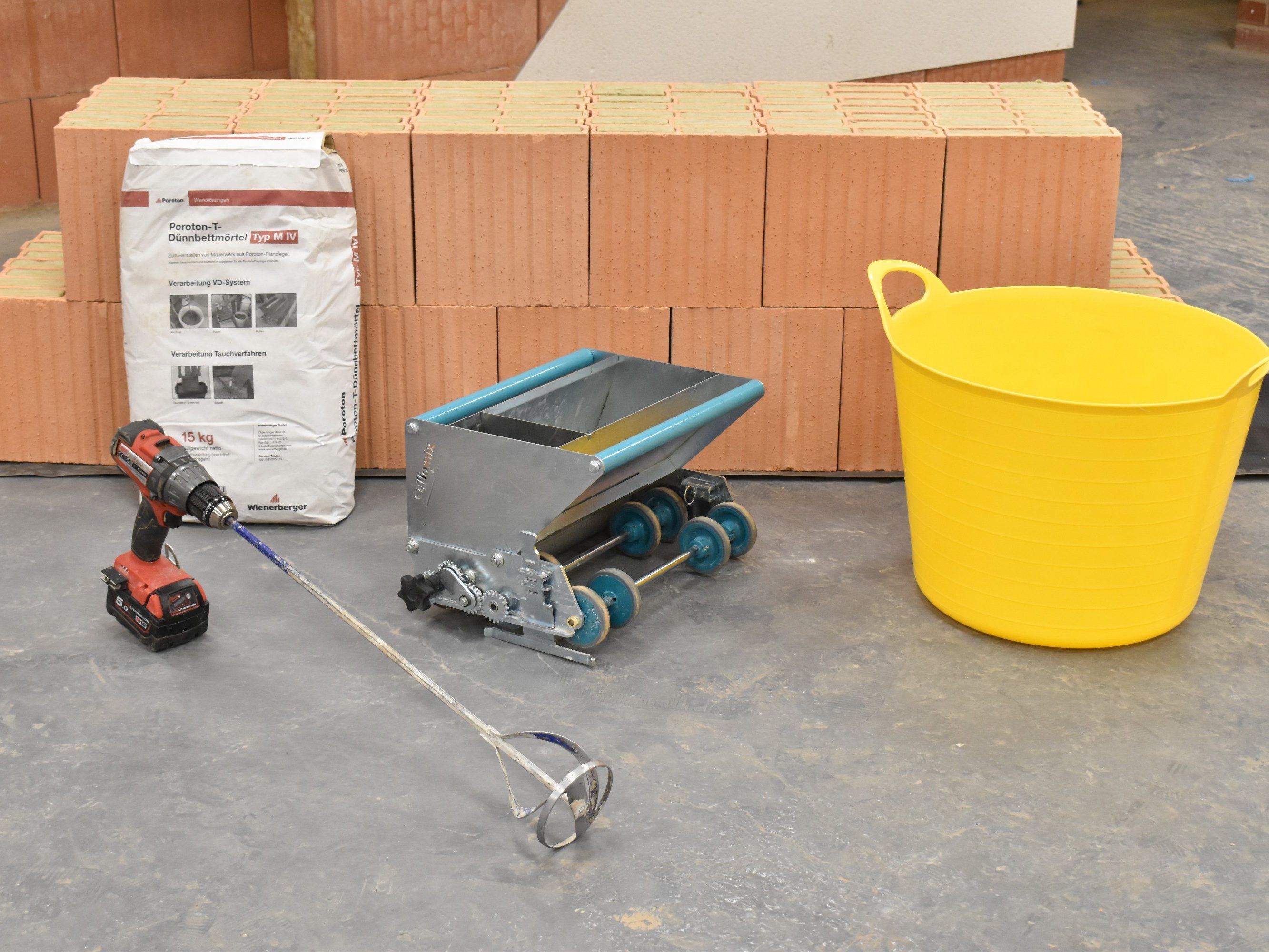 Porotherm blocks, roller, mixer and bucket