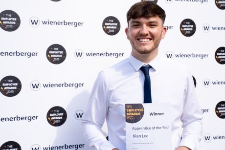 Apprentice Kian Lee holding his Employee Award Certificate