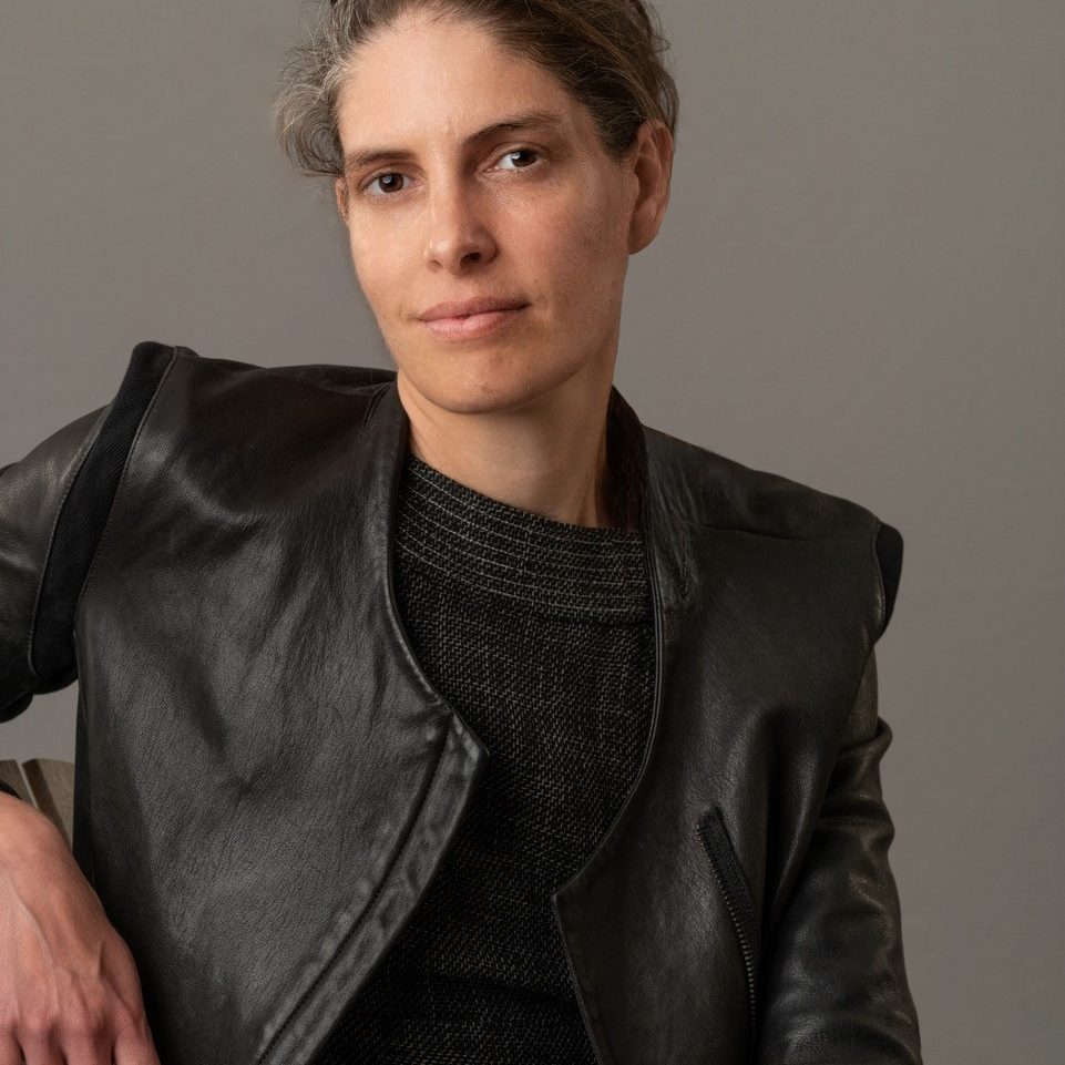 Head shot of Lydia Robinson with dark background
