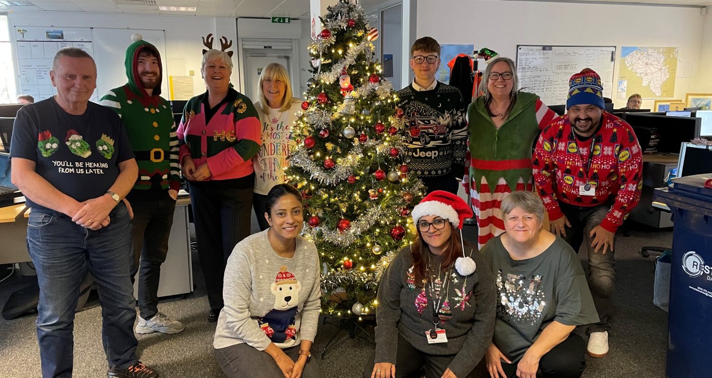 Cheadle Colleagues wearing christmas jumpers in the office