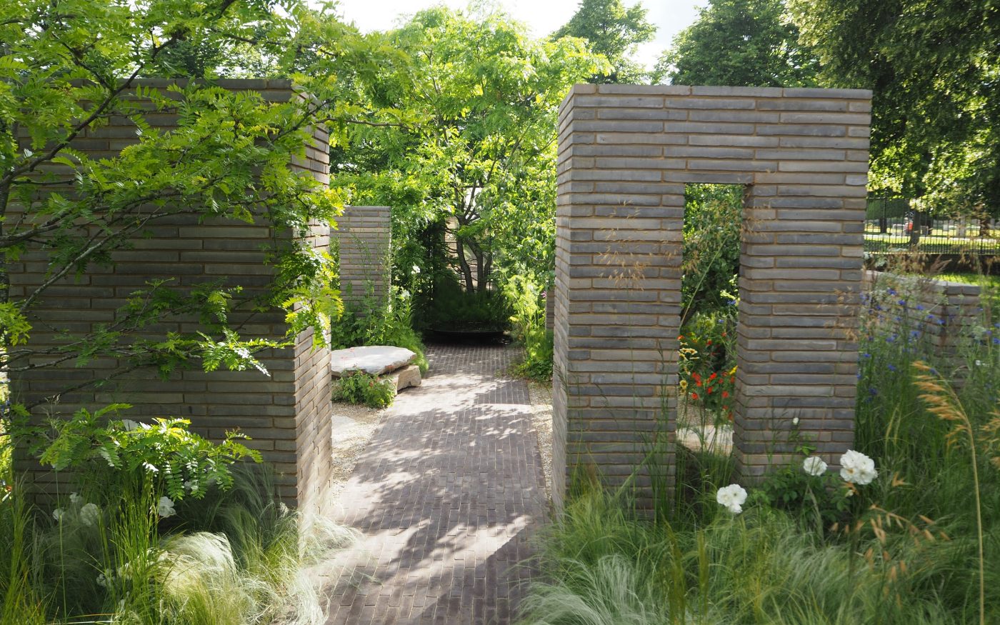 beautiful landscaped garden with paving and many plants