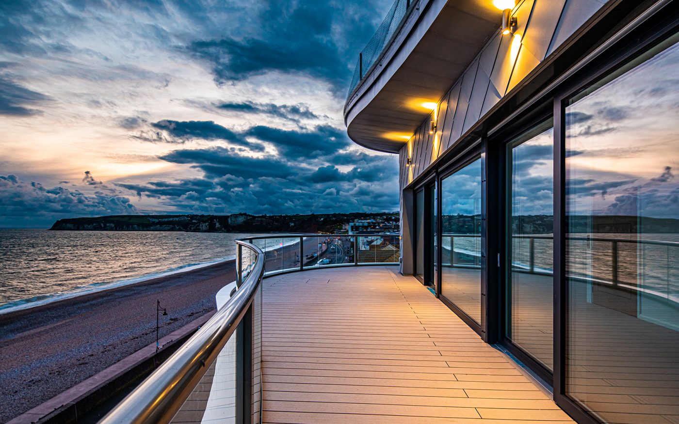 Balcony outside modern apartment building at dusk