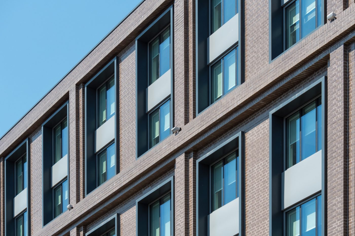 Exterior of modern hotel with glazed brick walls