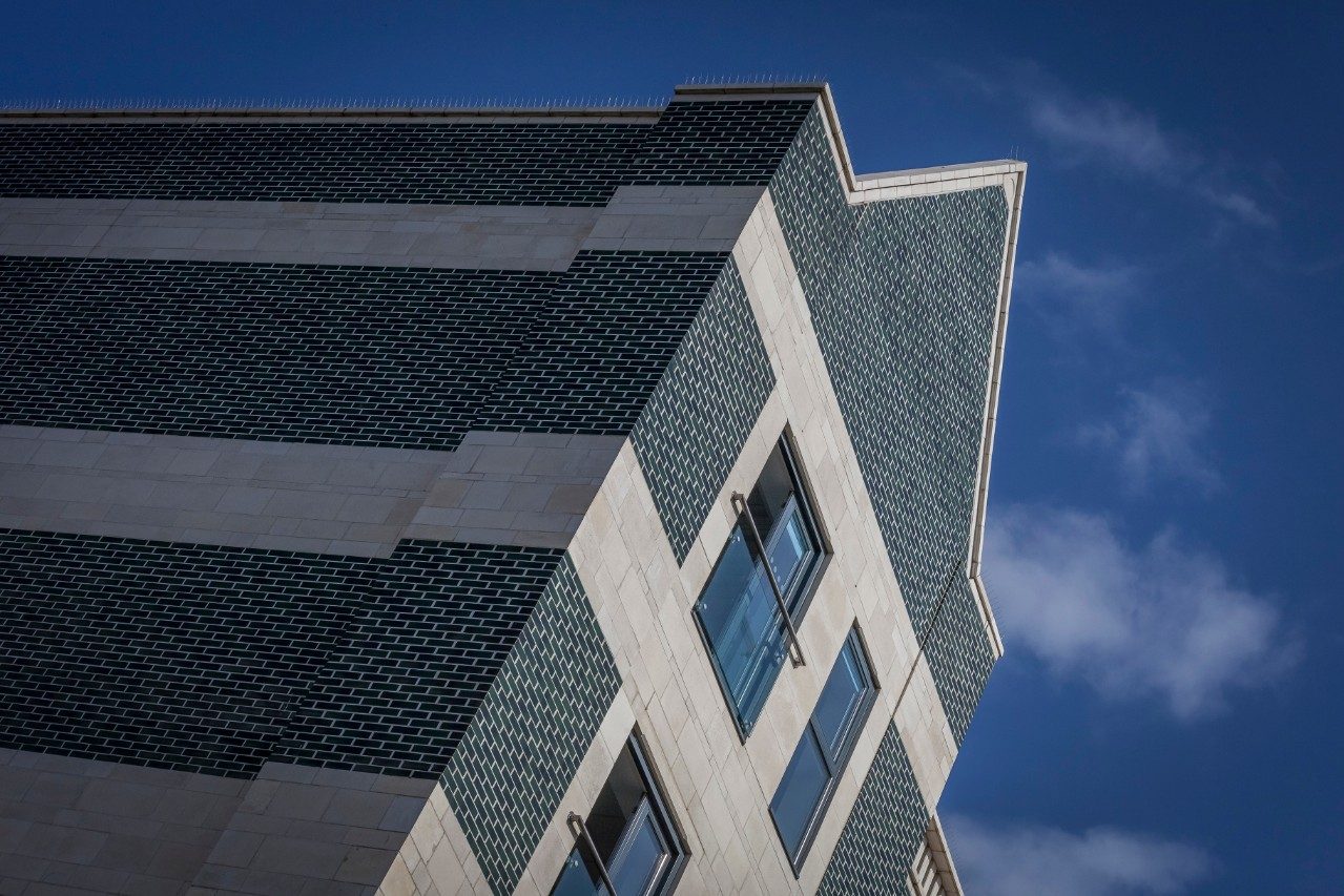 Green glazed brick facade on building on Swansea high street