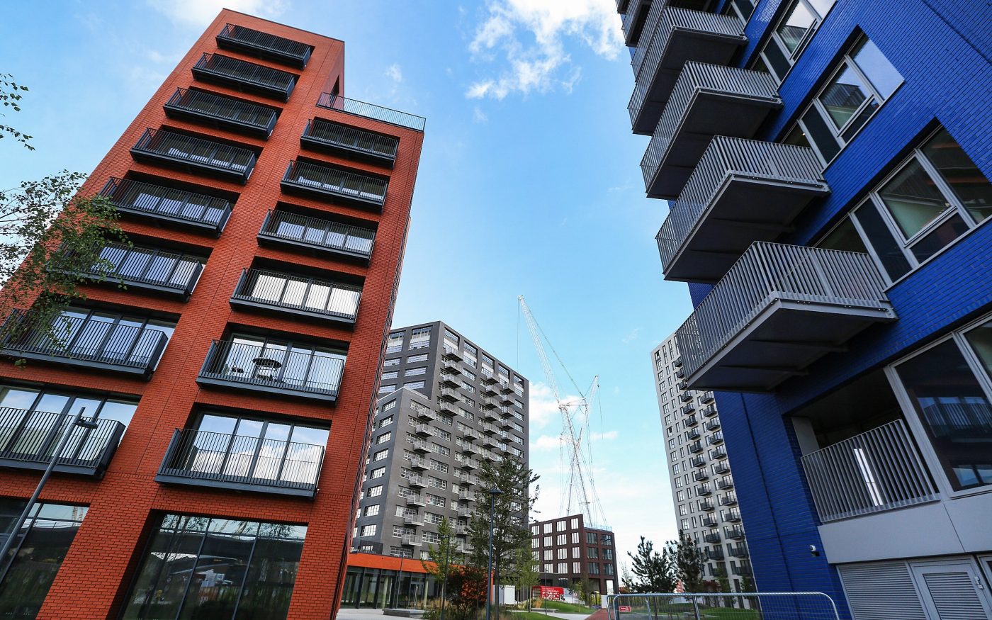 Red and blue glazed brick facades on apartment buildings
