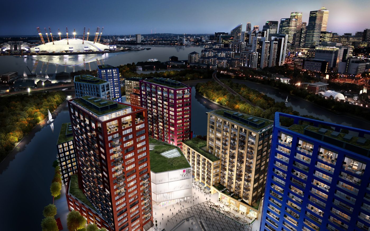 Night time view of London with red, blue and white glazed brick buildings in the foreground