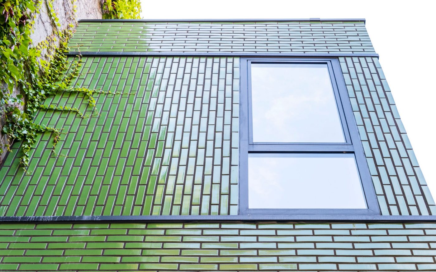 Window of green glazed brick house