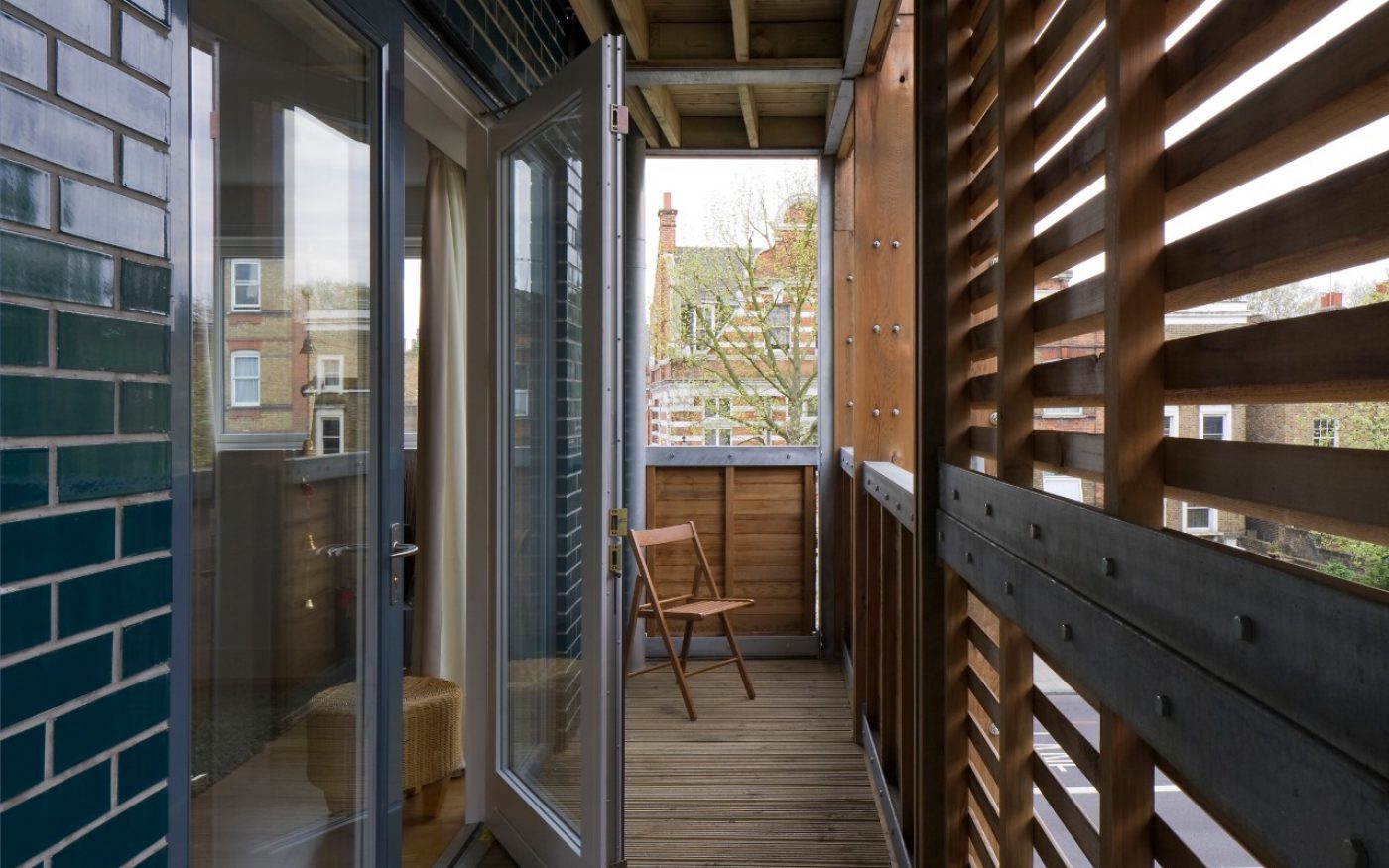 Residential balcony with green glazed brick wall