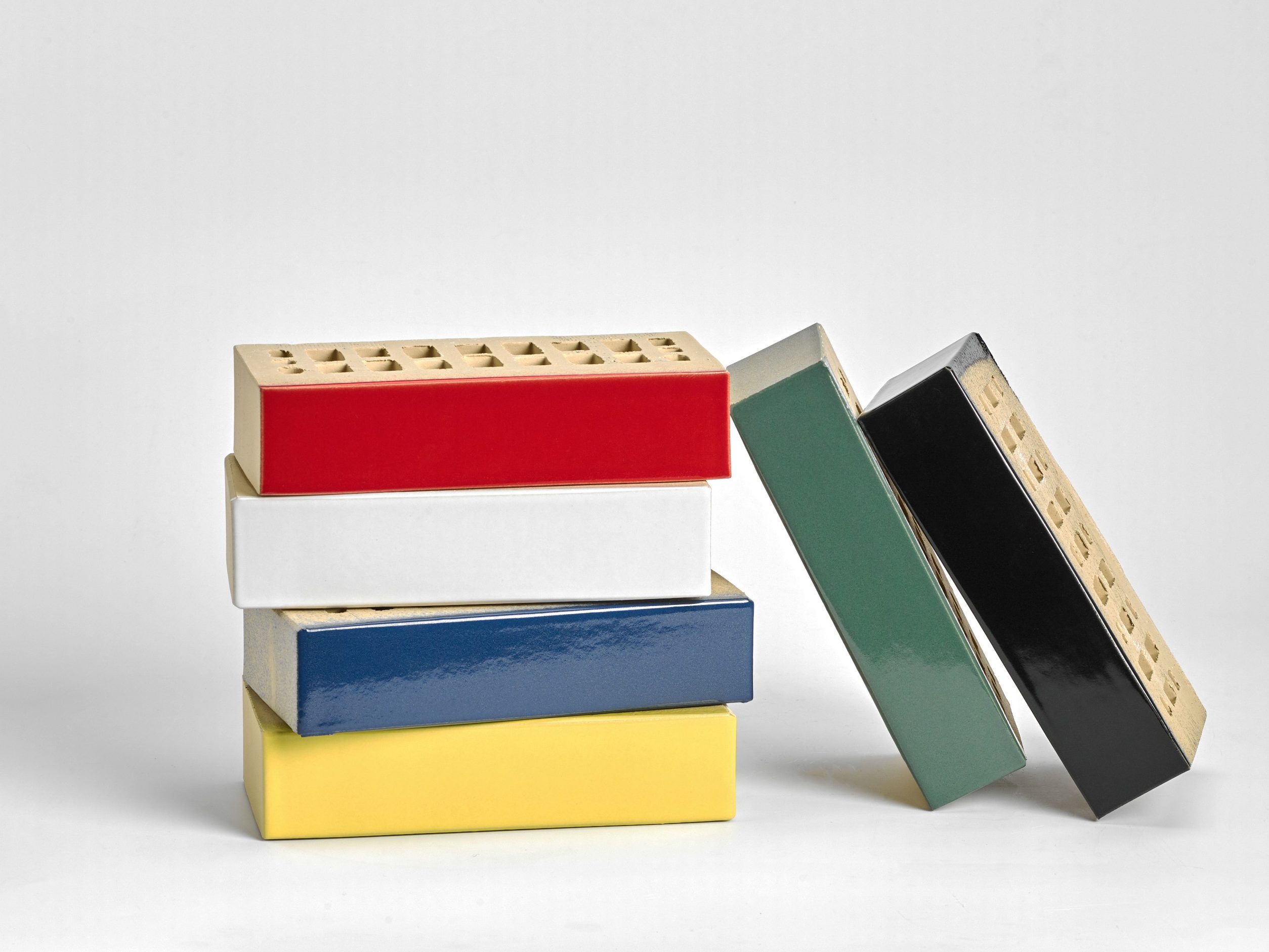 Stack of colourful glazed bricks