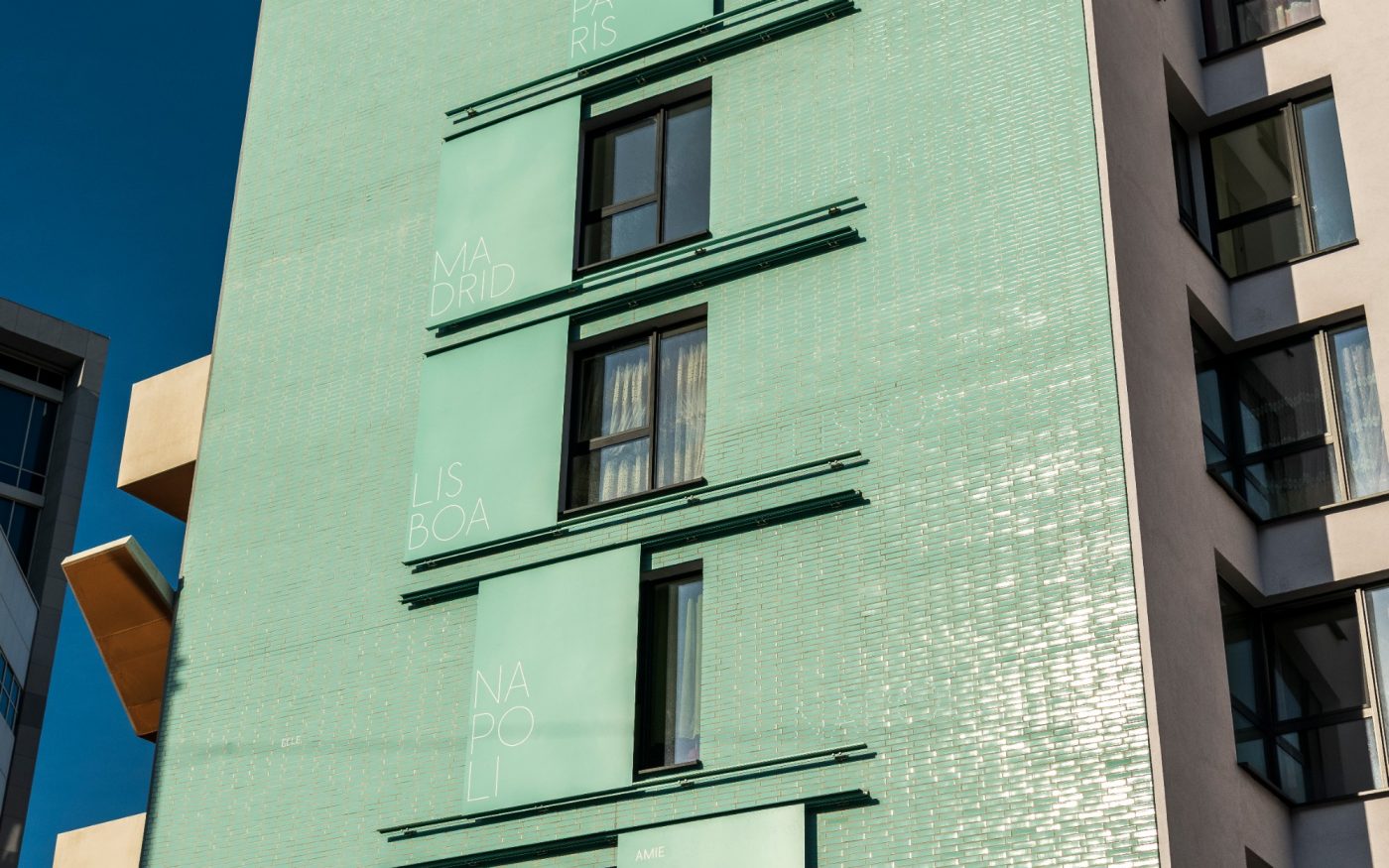 Mint green glazed brick high-rise building