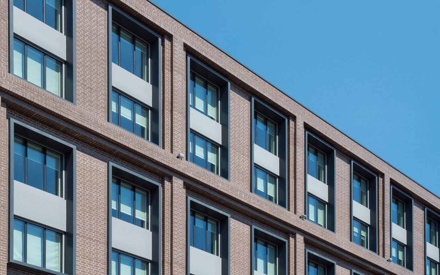Taupe glazed brick facade of Yotel hotel in London