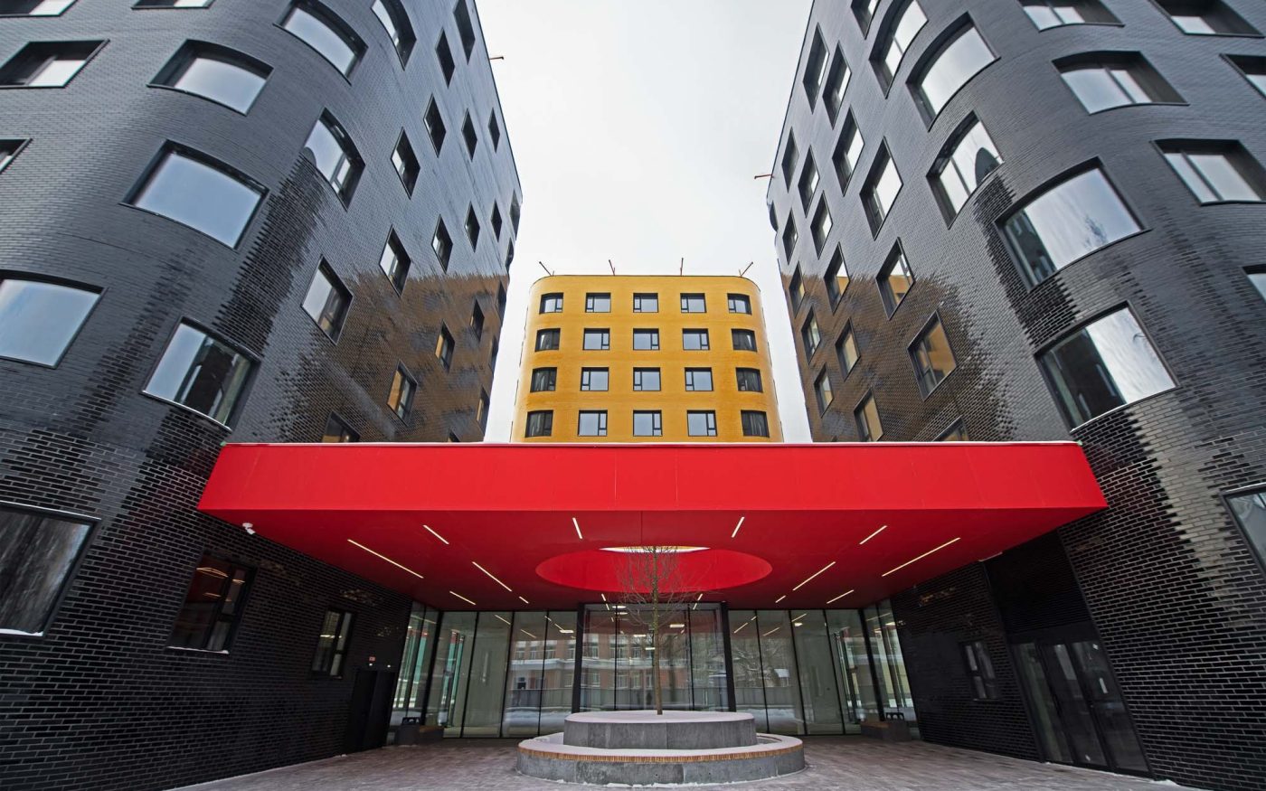 Apartment building featuring black and yellow glazed bricks