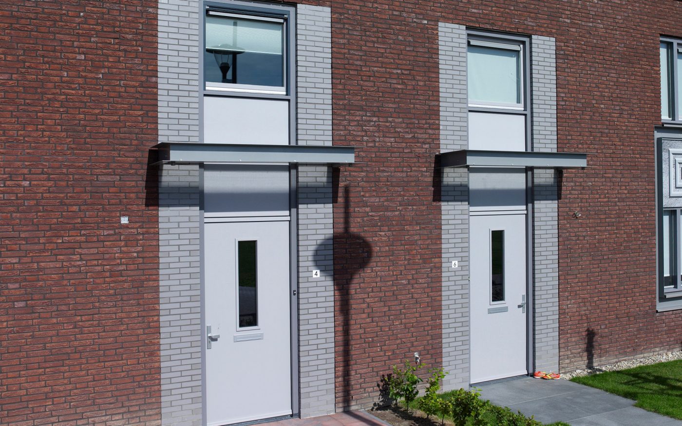 Grey glazed brick detailing around doorways