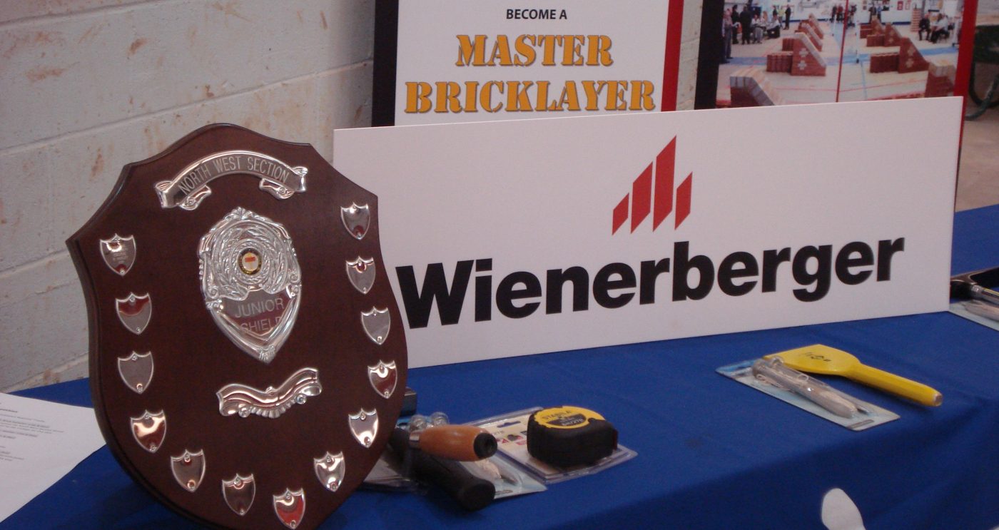 Award shield and Wienerberger sign on table