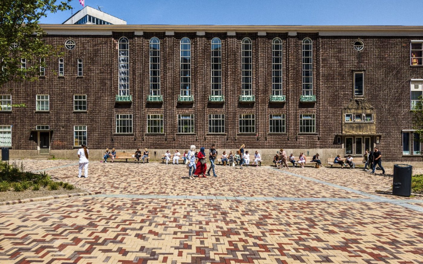 Shot showing paved path in front of building