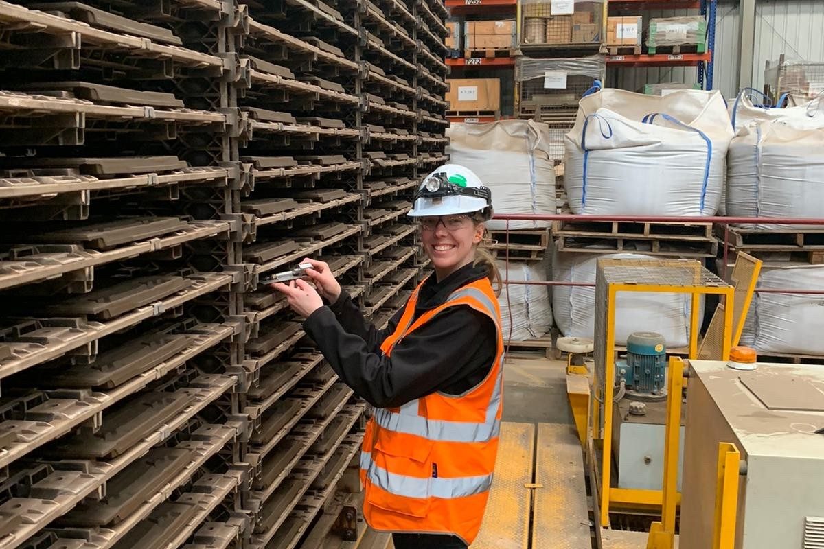 Emilande smiling whilst viewing roof tiles