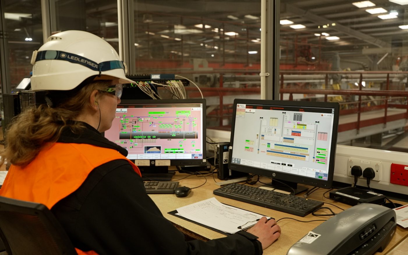 Emilande sat at a compture in the factory