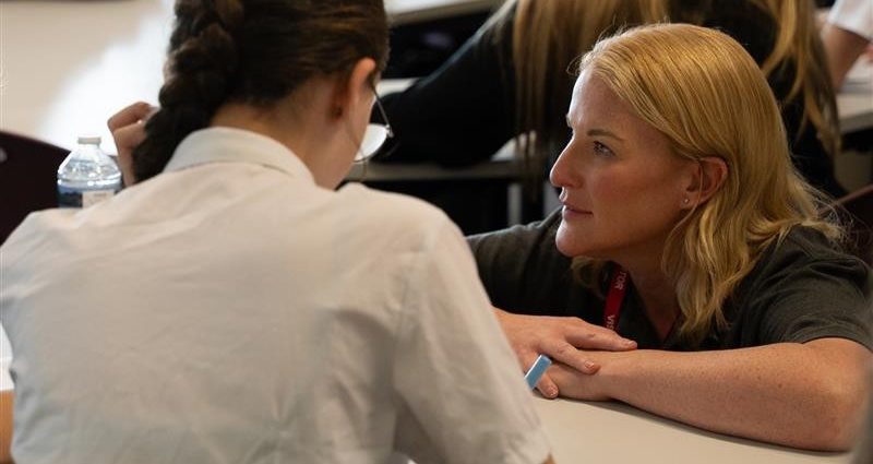 wienerberger employee talking to school stduents in a classroom