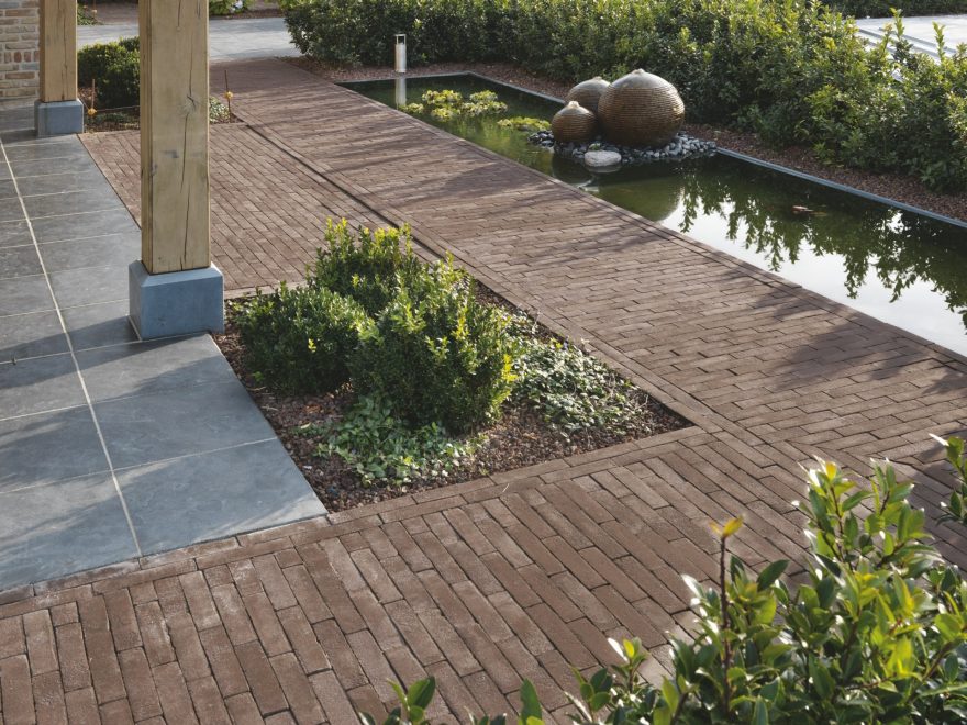 Clay paver path in landscaped garden