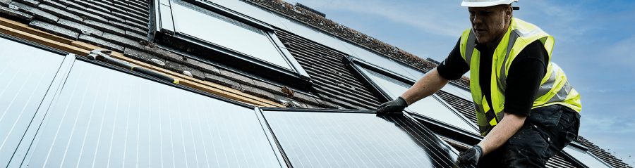 Contractor installing in-roof solar on roof