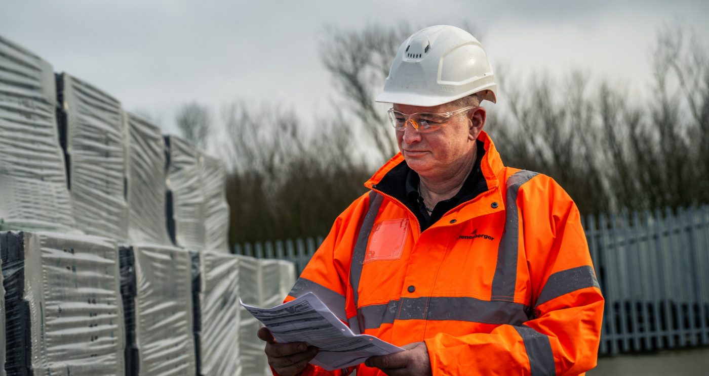 Stock Yard manager checking a clip board in a stock yard